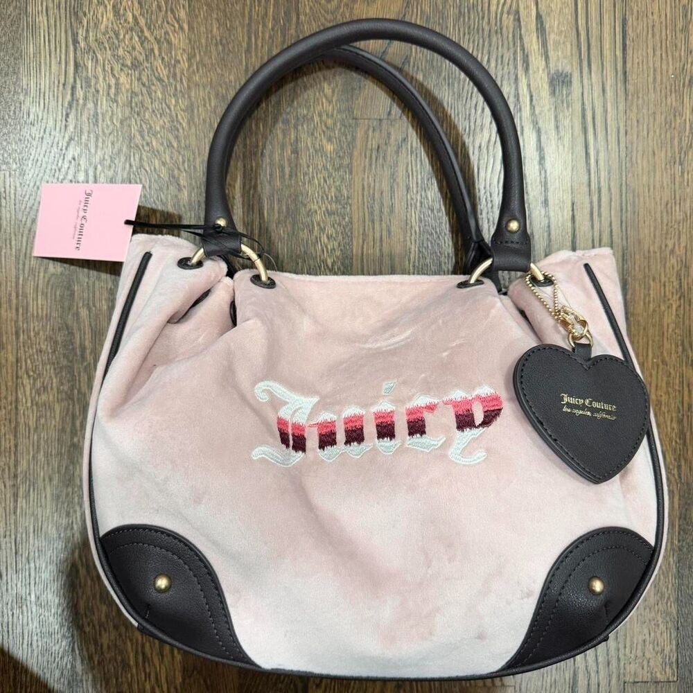 pink velvet juicy couture bag with heart-shaped tag